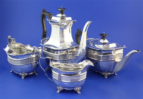 A late Victorian matched four piece silver tea and coffee set and pair of tongs, gross 63.5 oz.